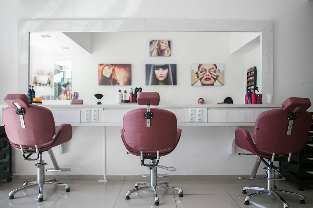 Plum salon chairs and a bright, welcoming studio